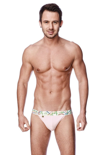 A light pink zen jock strap with a colorful geometric patterned waistband showing the front side