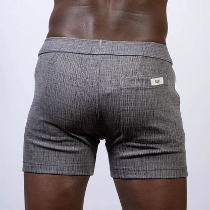 Gray textured abstract linen texture shorts with subtle herringbone pattern and white brand tag on back waistband