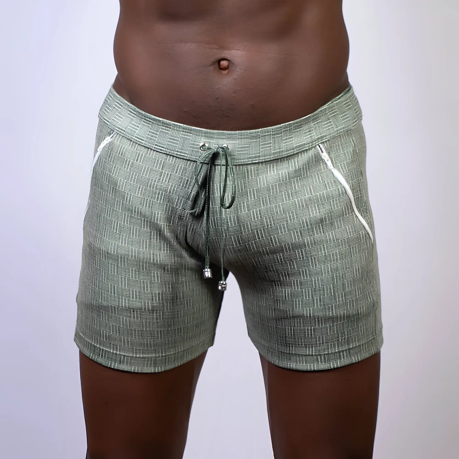 Olive green abstract linen texture shorts with white zipper accents and drawstring waistband for casual wear