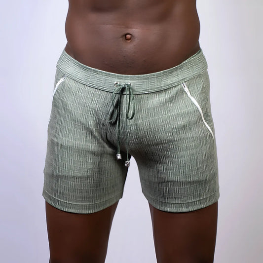 Olive green abstract linen texture shorts with white zipper accents and drawstring waistband for casual wear