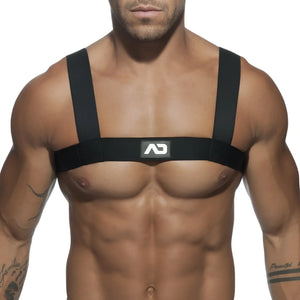 Black ad basic harness chest strap with adjustable shoulder straps and central logo patch showing front side