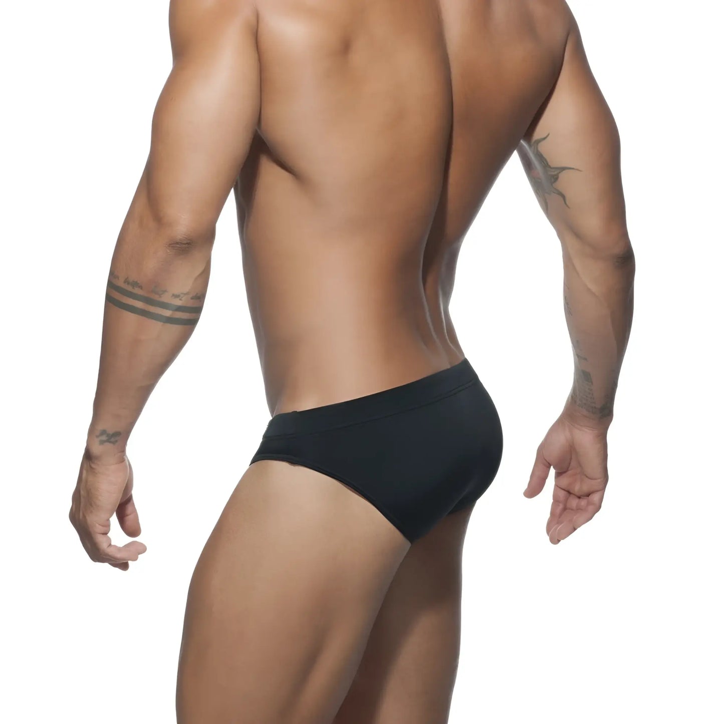 Black ad basic swim brief made of stretchy material shown from the back for comfortable swimwear use