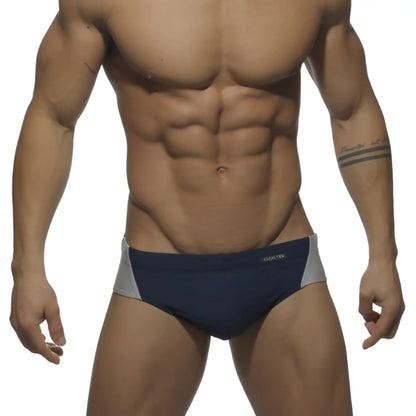 Navy blue and gray swim trunks with addicted silver logo and sleek modern design in size S for swimwear use