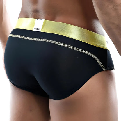 Black Agacio AGJ013 brief with shiny yellow waistband and white stitching along the side seam