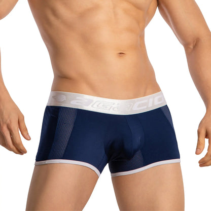 Navy blue agacio boxer sheer trunks with white mesh panels and silver logo waistband showing front view