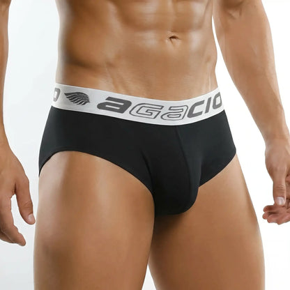 Black Agacio Zotico Live Classic Brief with white branded waistband on a male model, front product view