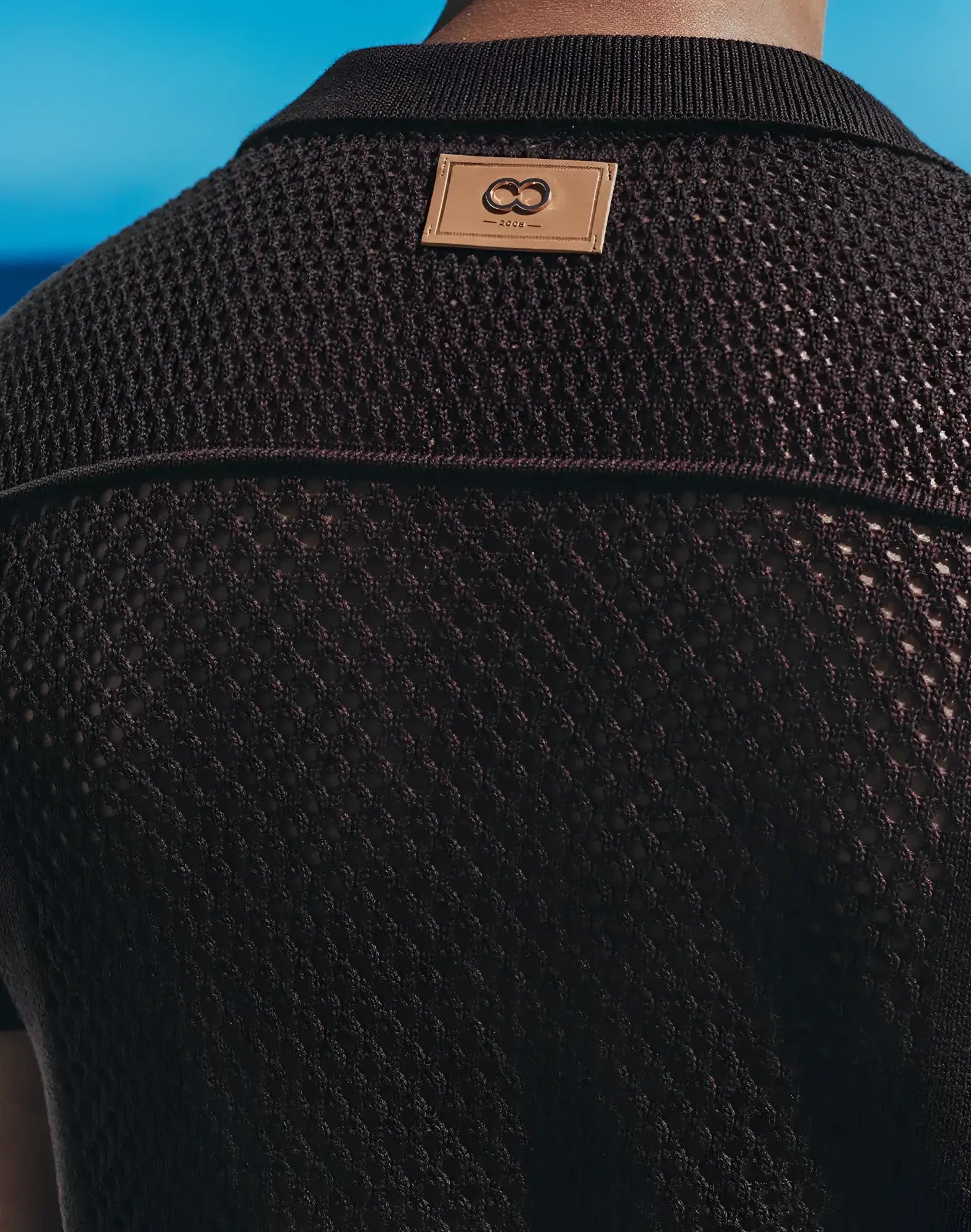 Amafi knit shirt black textured knit polo with tan leather patch and interlocking double o logo