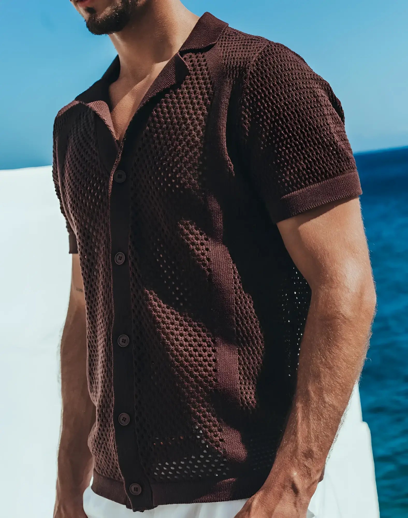 A dark brown short-sleeved knit cardigan with honeycomb texture and button closure from amafi knit shirt collection