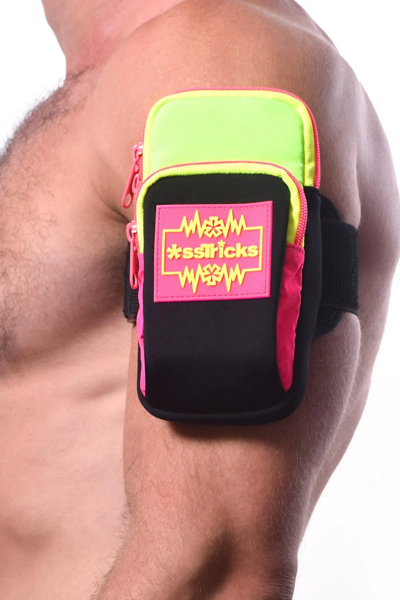 Neon green and black arm bag with pink zipper accents and bold sstricks logo patch for hands-free carrying
