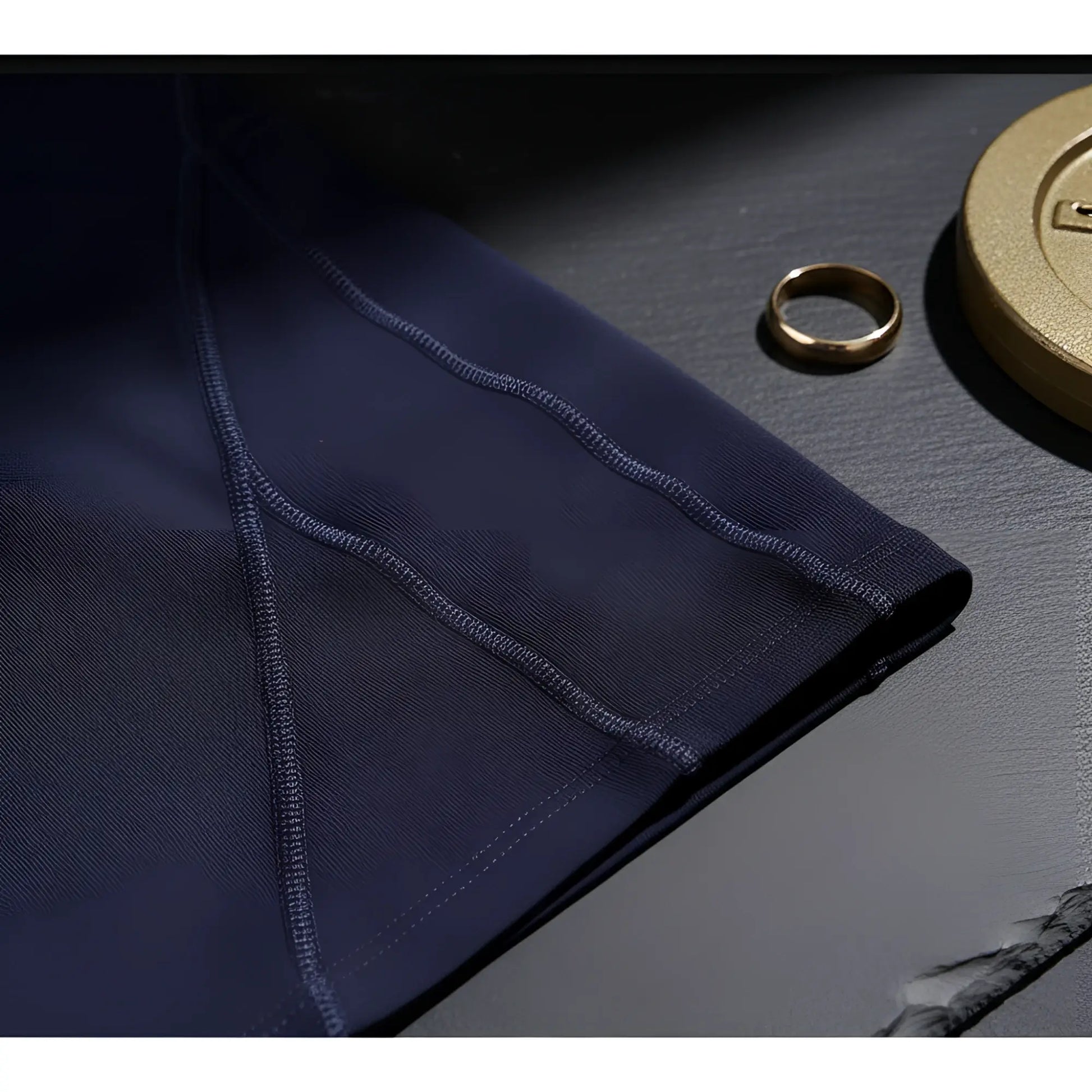Dark navy arroyman bulge runner tights performance shorts with reinforced stitching along the arm seam