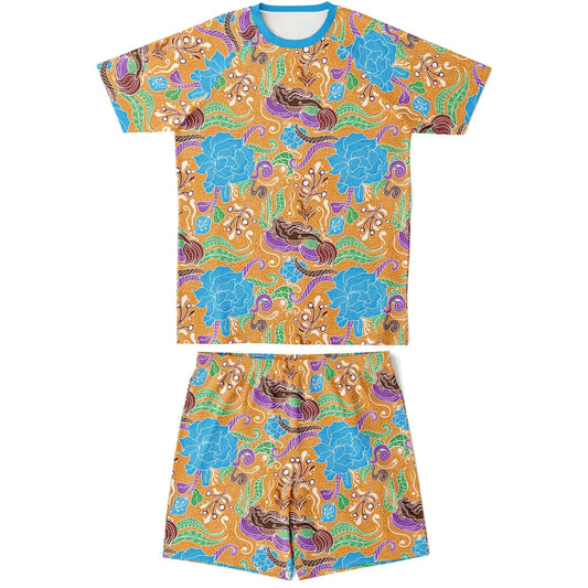 Colorful batik print shorts and top set for men by Maris Equi featuring vibrant floral and abstract patterns in orange and blue.