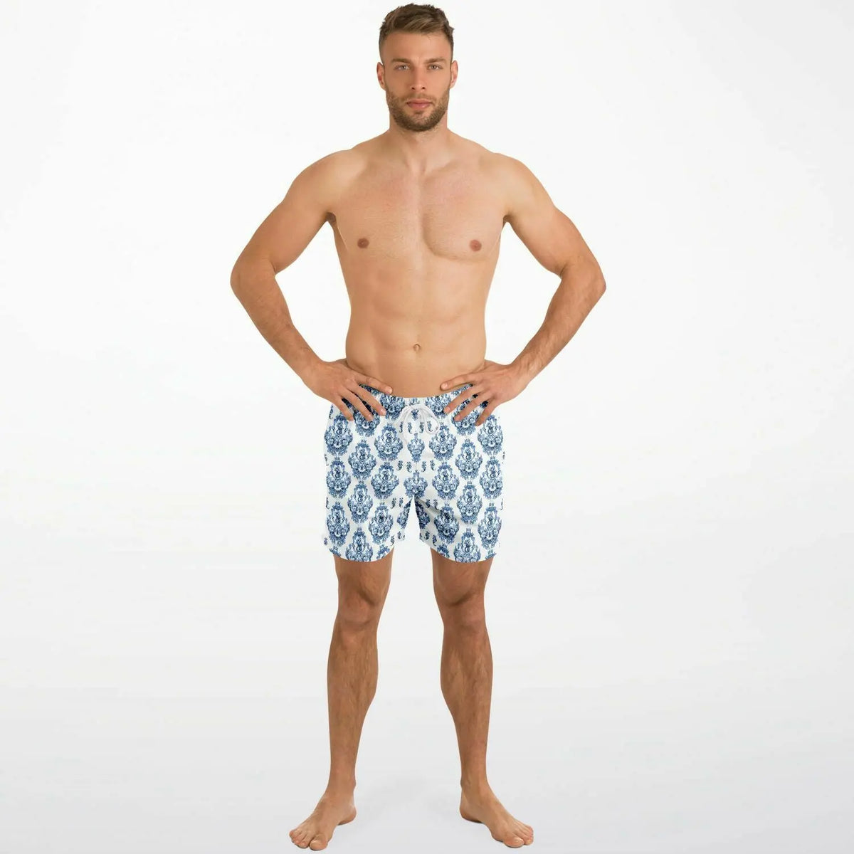 Men's swim shorts in blue and white baroque pattern made by Maris Equi featuring an elastic waistband and side pockets.
