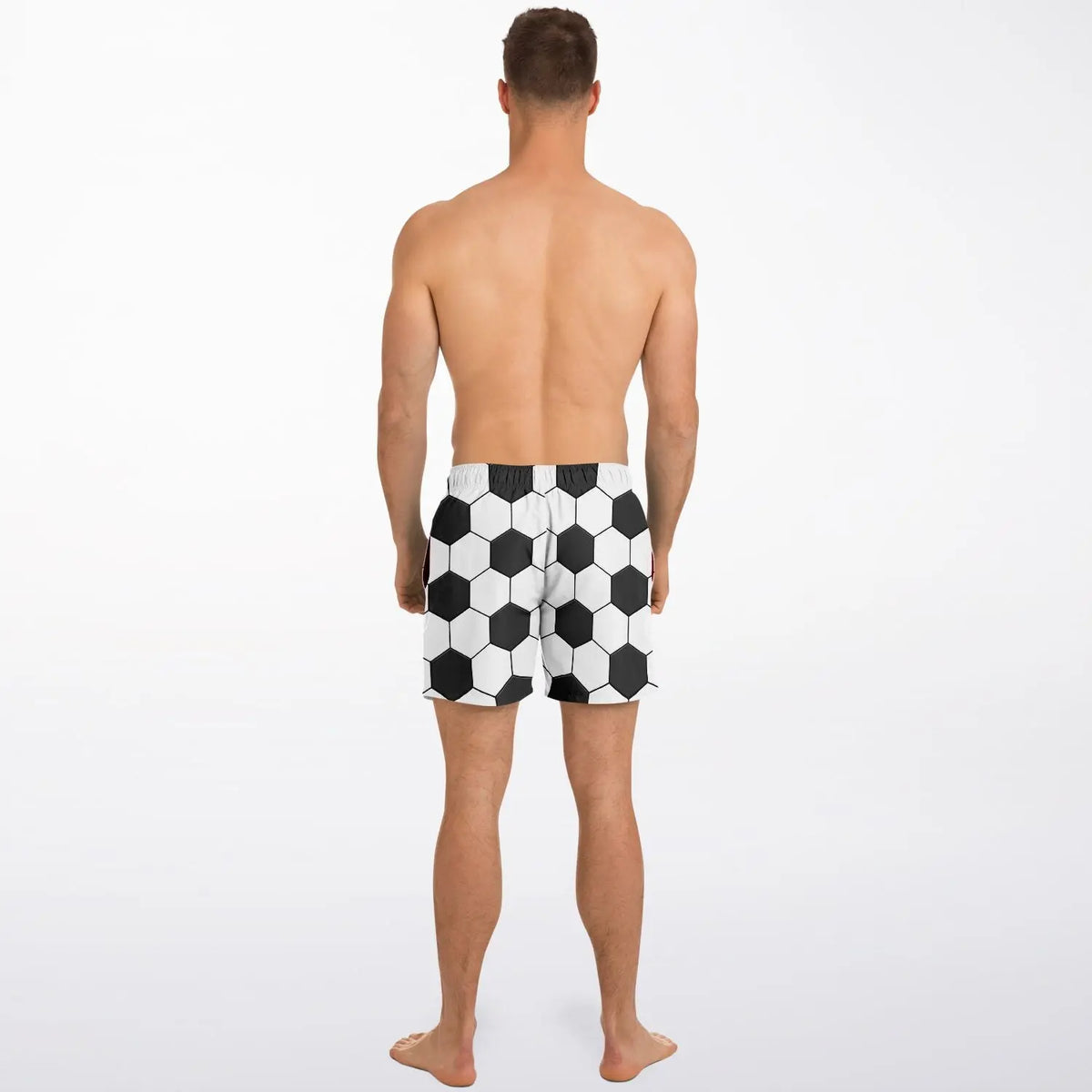 Men's swim shorts by Maris Equi featuring a black and white soccer ball pattern elastic waistband and above-the-knee cut.