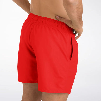 Red men's swim shorts by Maris Equi featuring an elastic waistband and side pockets shown from the back.