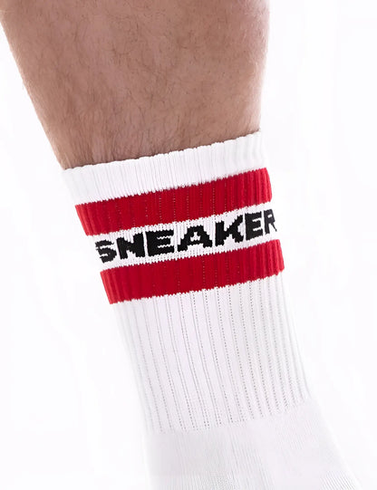 White athletic sneaker half sock with bold red stripe and black sneaker lettering on cuff by barcode berlin