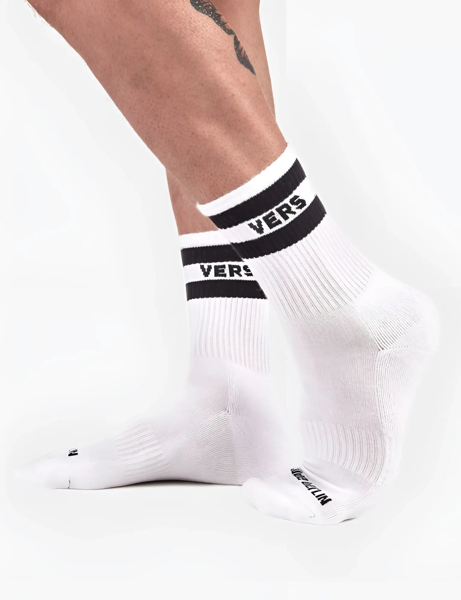 White crew socks with black and white striped cuffs featuring vers logo by converse barcode berlin fetish vers half socks size l/xl