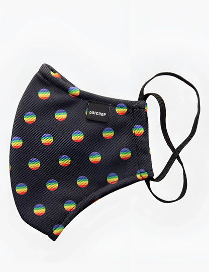 Black fabric face mask by barcode berlin with rainbow circular patterns and black elastic ear loops unisex one size