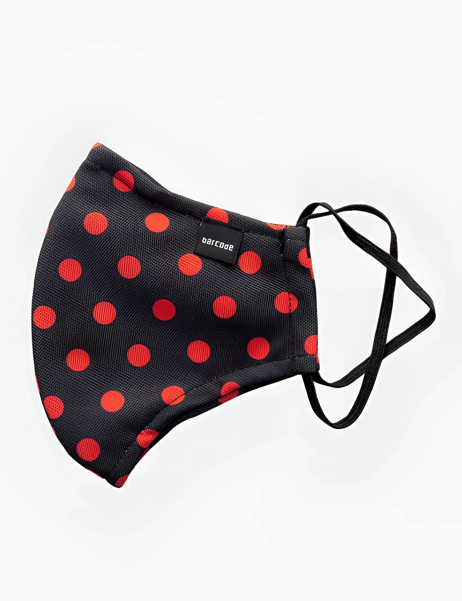 Black fabric face mask with bold red polka dots and black elastic ear loops by barcode berlin unisex one size