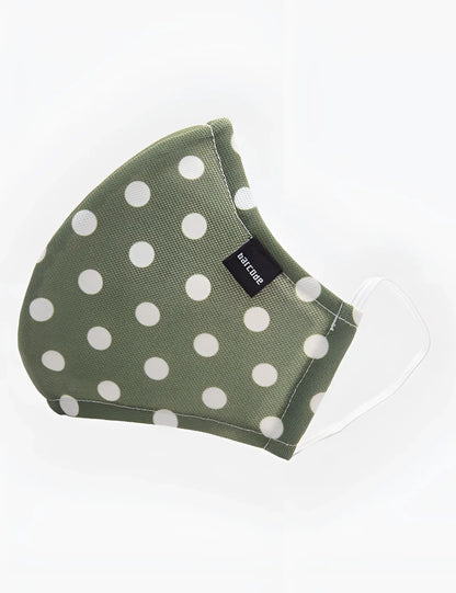 Olive green fabric face mask with white polka dots and clear elastic ear loops barcode berlin unisex one size