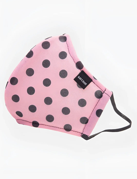 Pink polka-dot face mask with black dots and a small black barcode tag by Barcode Berlin unisex one size
