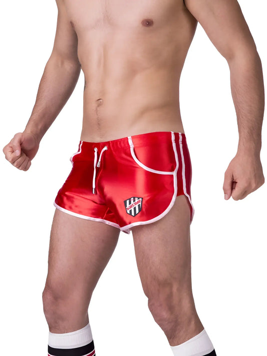 Red satin athletic shorts with white trim and black white shield logo on left leg barcode berlin shiny dean shorts xl