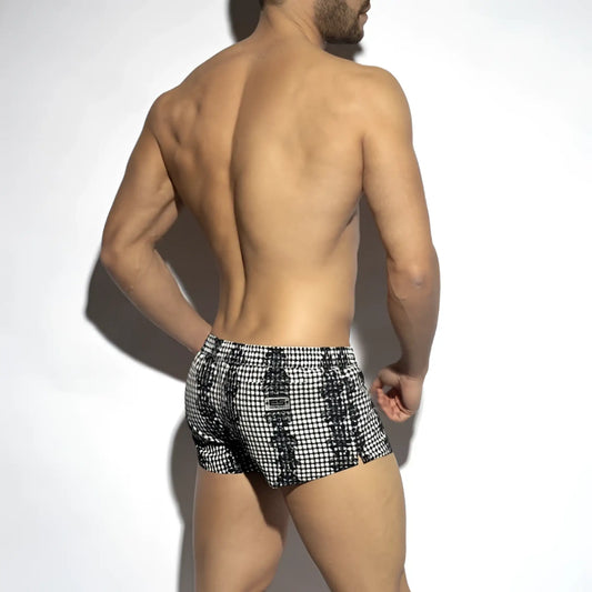 Black and white checkered swim trunks with a bold geometric pattern from Baroque Squared swim shorts collection