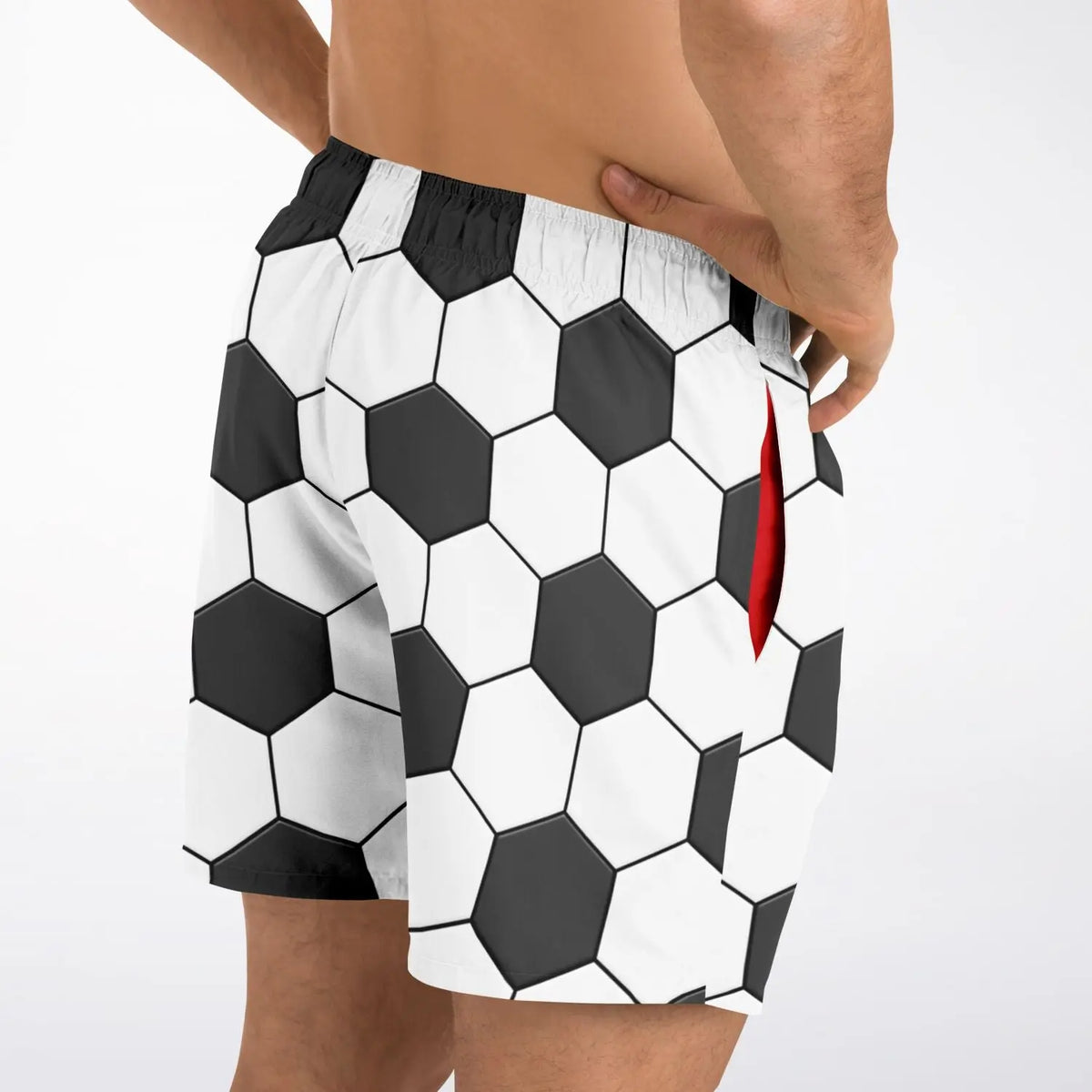 Men's swim shorts by Maris Equi featuring a soccer ball hexagon pattern in black and white with a red side pocket.