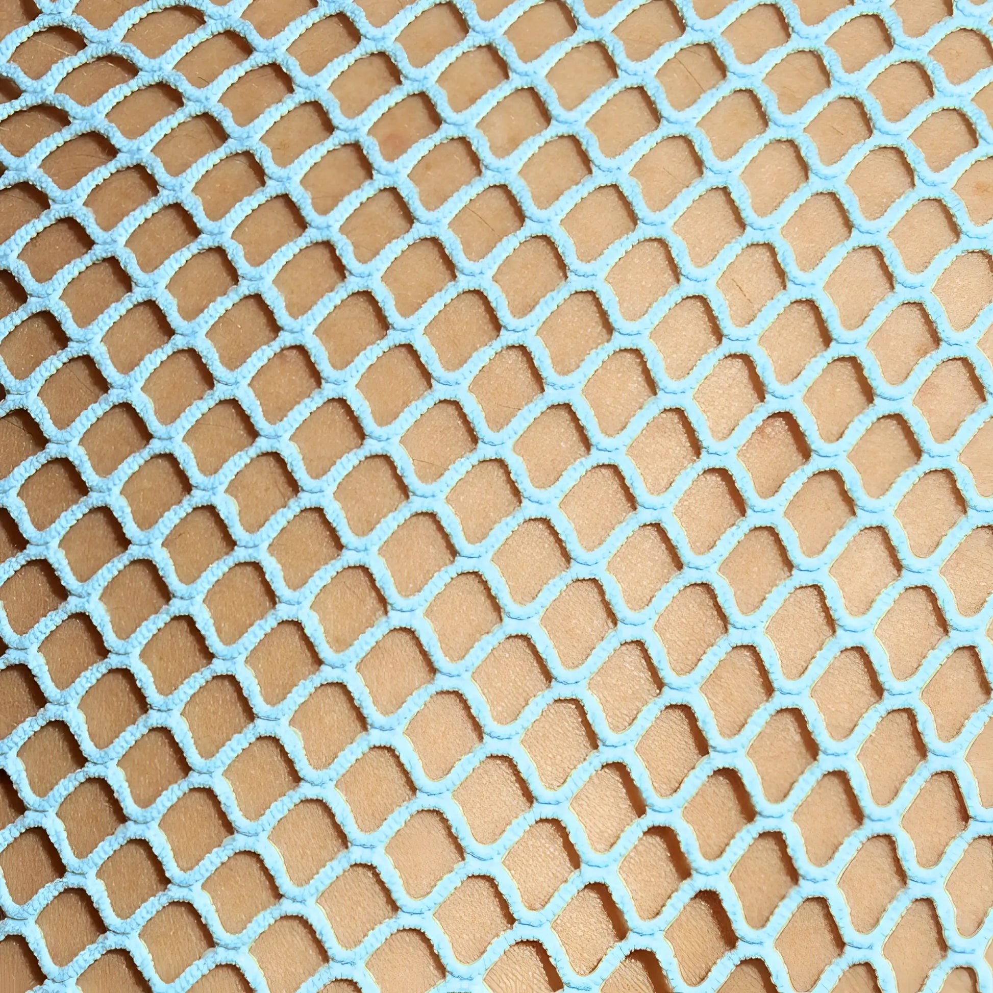 Light blue mesh fabric with diamond-shaped pattern on beachy net tank top front side for beachwear