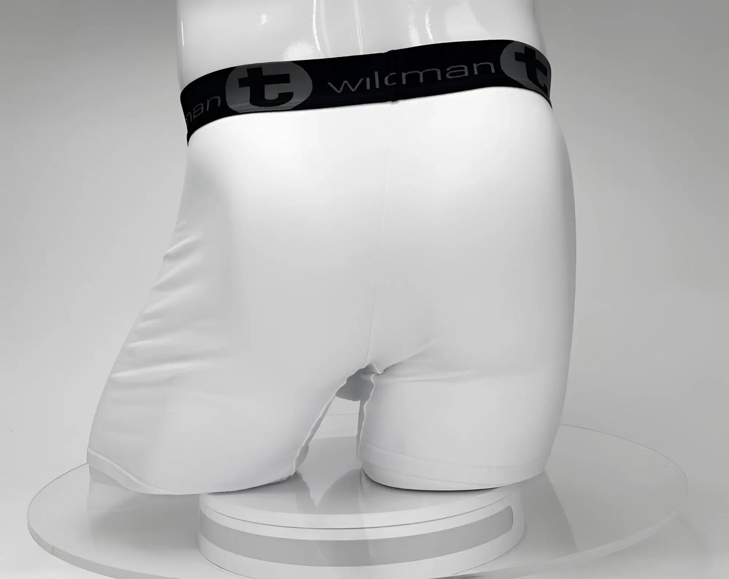 White wilkman boxer briefs with a big boy pouch 5 inch inseam and black elastic waistband featuring wilkman logo