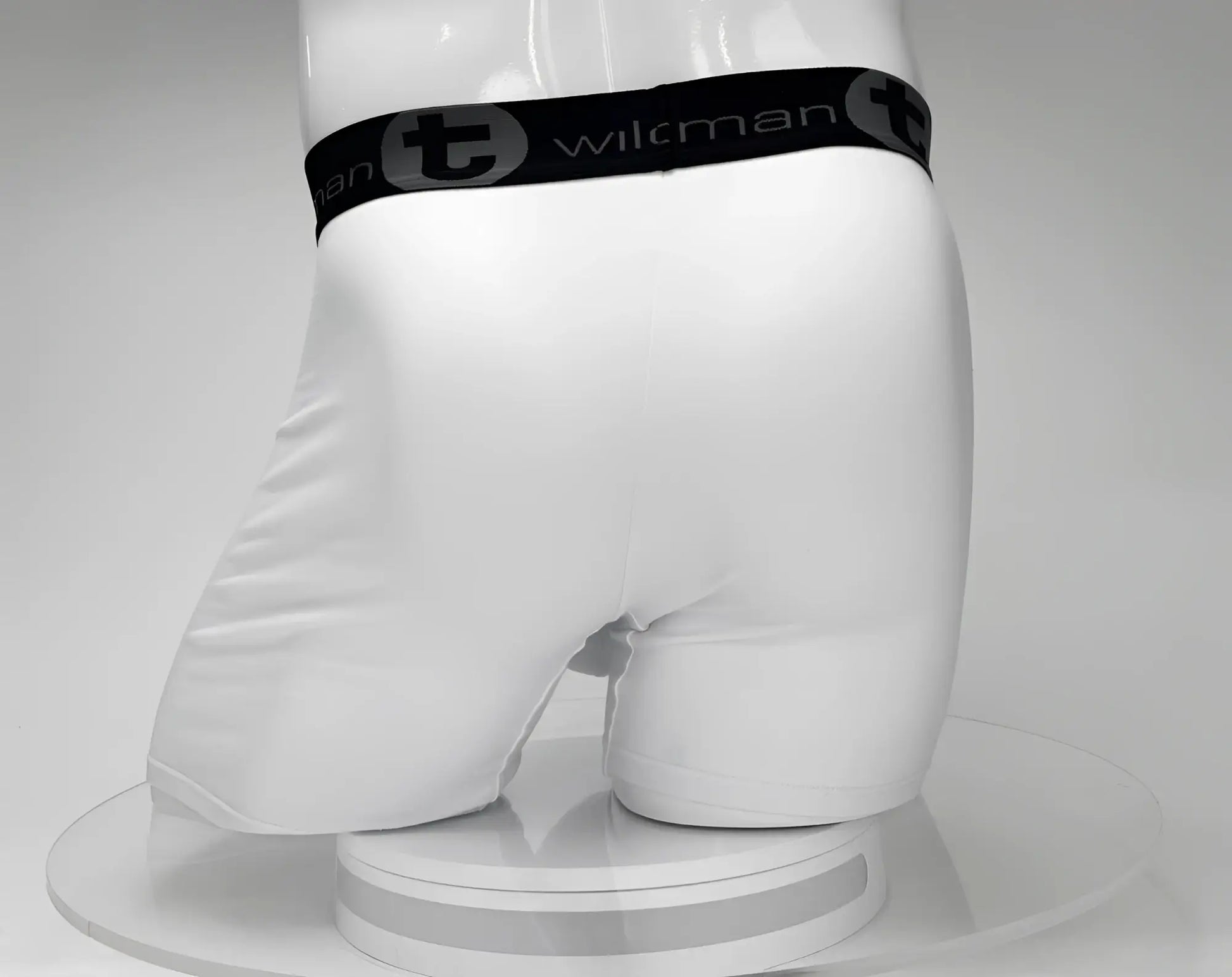 White wilkman boxer briefs with a big boy pouch 5 inch inseam and black elastic waistband featuring wilkman logo