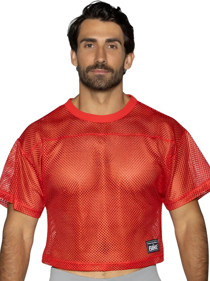Red mesh crop top with solid red ribbed neckline and hem with black bike patch in bright red for athletic practice