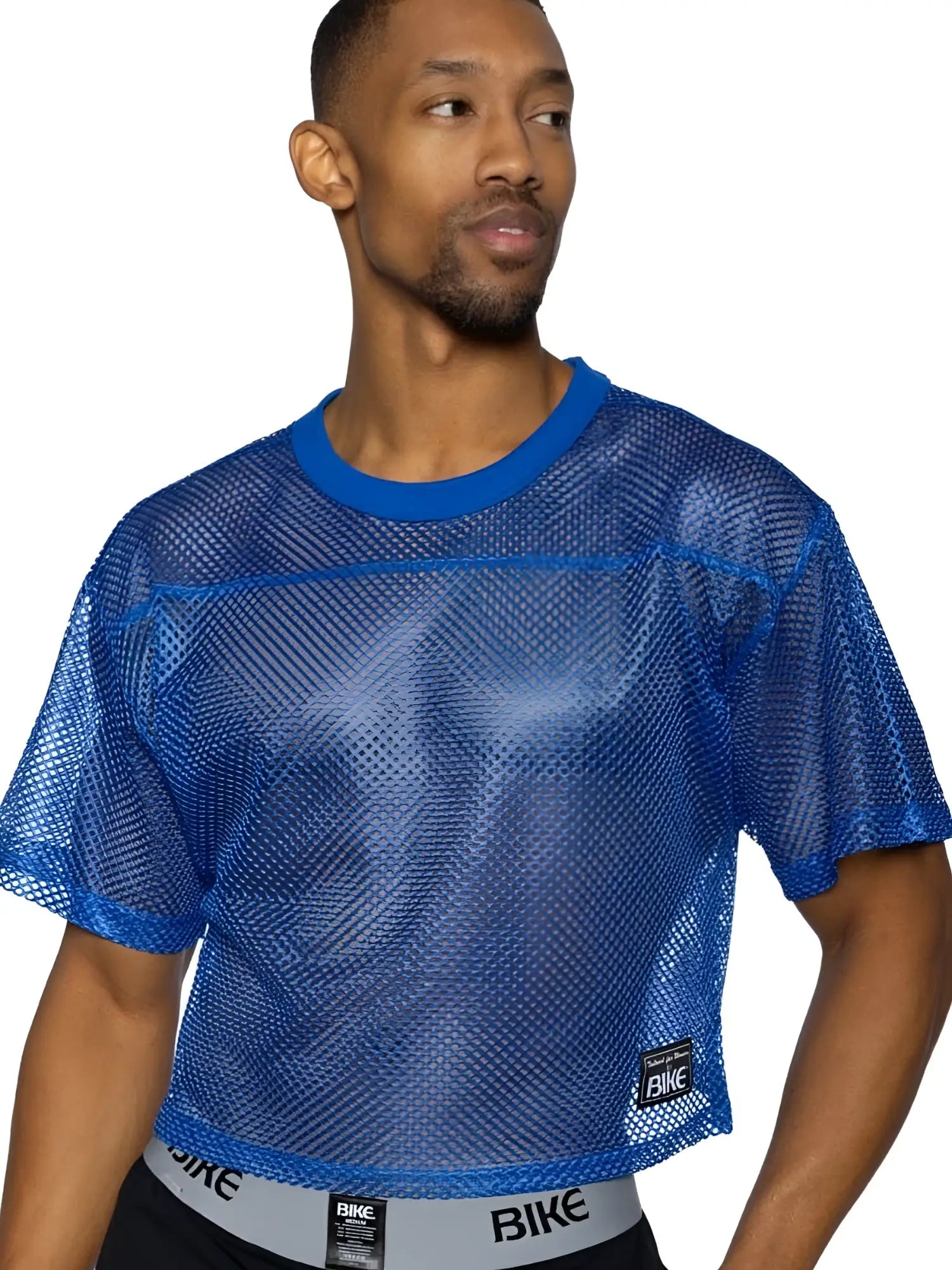 Blue mesh crop top with solid blue ribbed neckline and hem featuring bike logo in royal color for athletic use