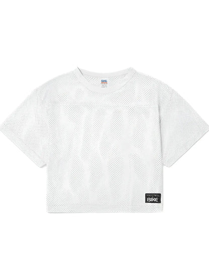 White mesh crop top with subtle geometric pattern and black bike label on lower right side for athletic practice