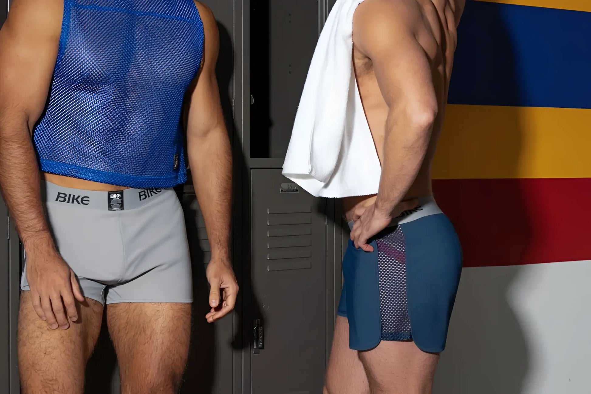 Gray athletic briefs with mesh panels and Bike branding, shown with a royal blue sleeveless jersey.