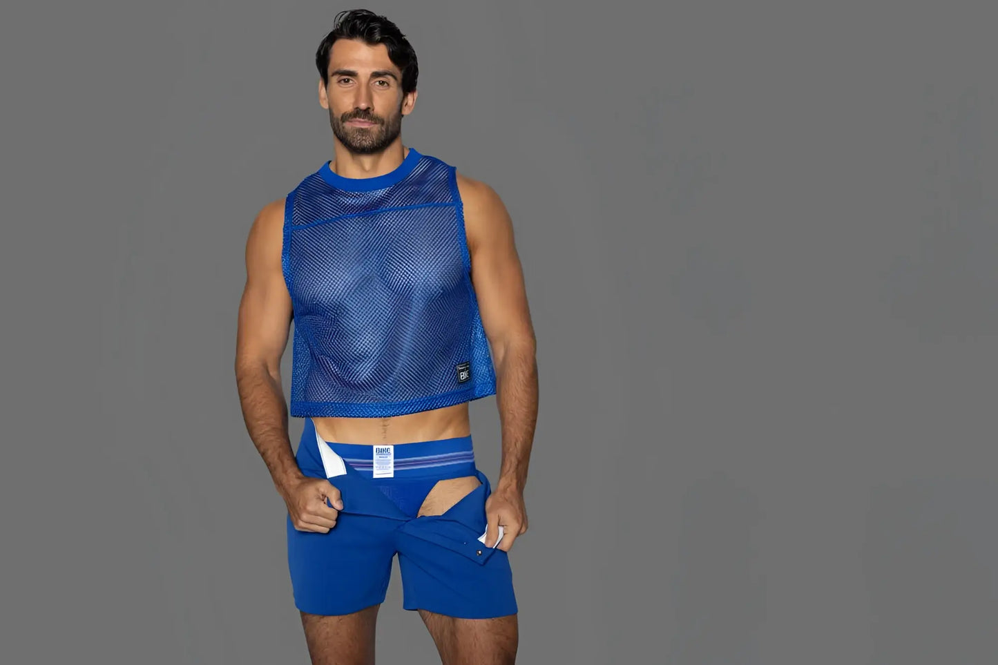 Blue mesh sleeveless practice jersey with cropped hem and subtle branding on lower left by BIKE Athletic
