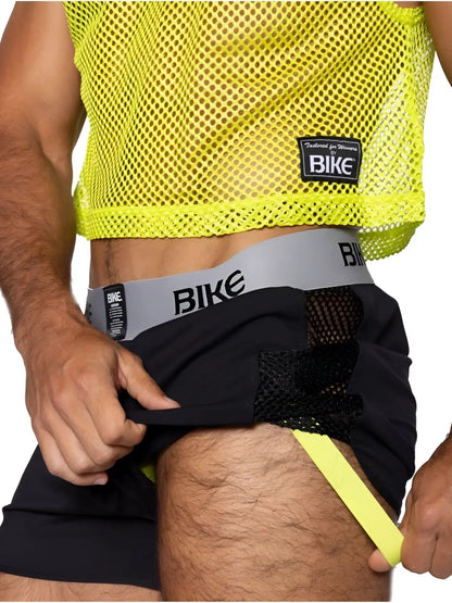 Bright neon yellow mesh crop top with black fabric accents and a Bike branded waistband in jock short style.