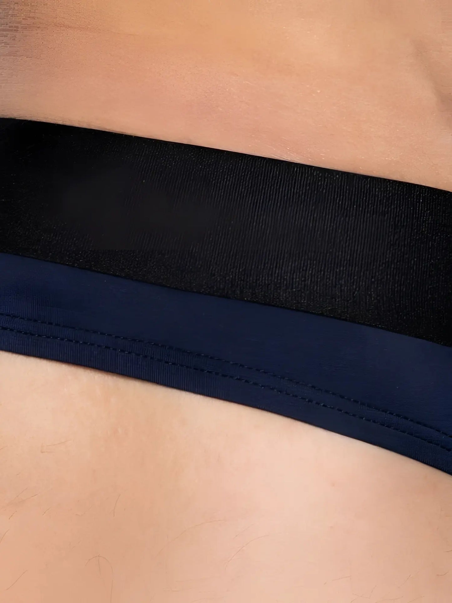 Black and navy blue elastic waistband with visible stitching on the back of bike athletic bas319 active thong navy