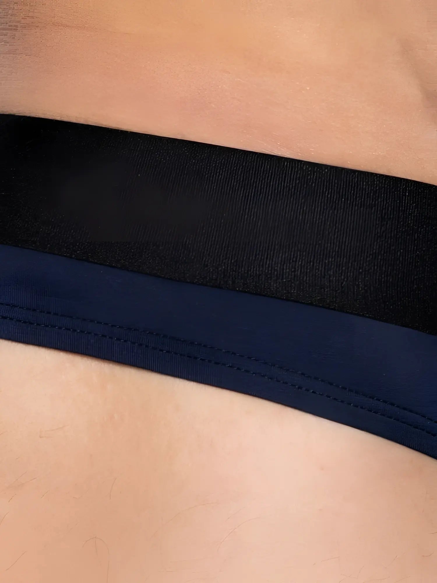 Black and navy blue elastic waistband with visible stitching on the back of bike athletic bas319 active thong navy