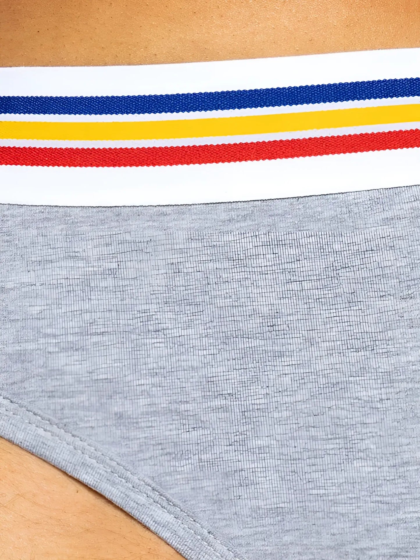 Gray heathered bike athletic bas327 stretch cotton brief with white elastic waistband featuring blue yellow and red stripes