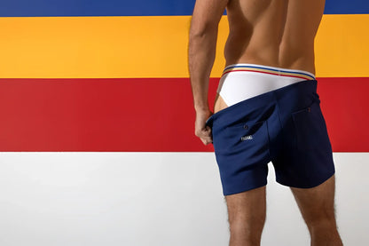 Navy blue bike athletic stretch cotton briefs with white waistband and thin red yellow blue stripes front view