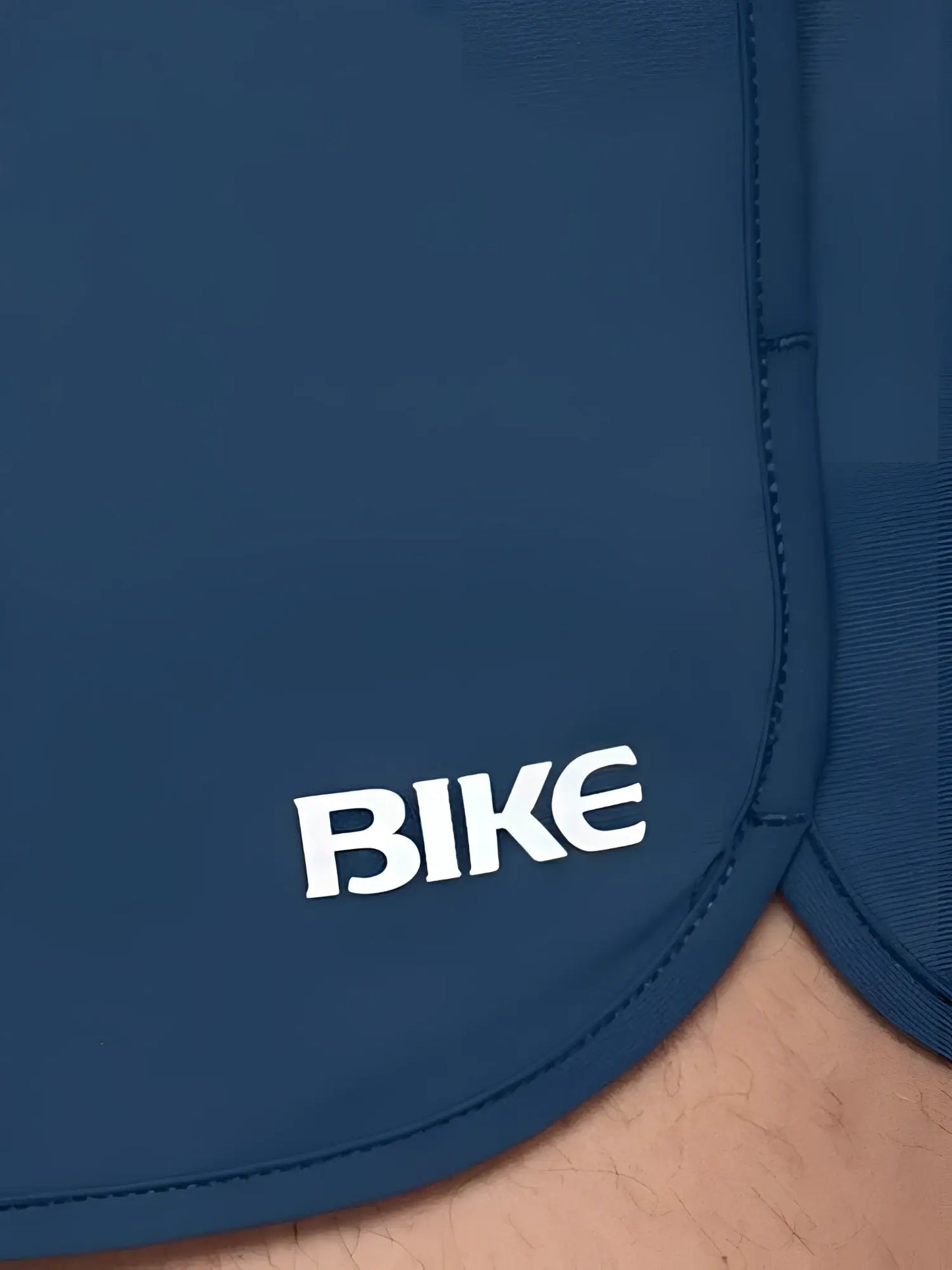 Dark blue bike track short with white bike logo embroidered on the side perfect for athletic use