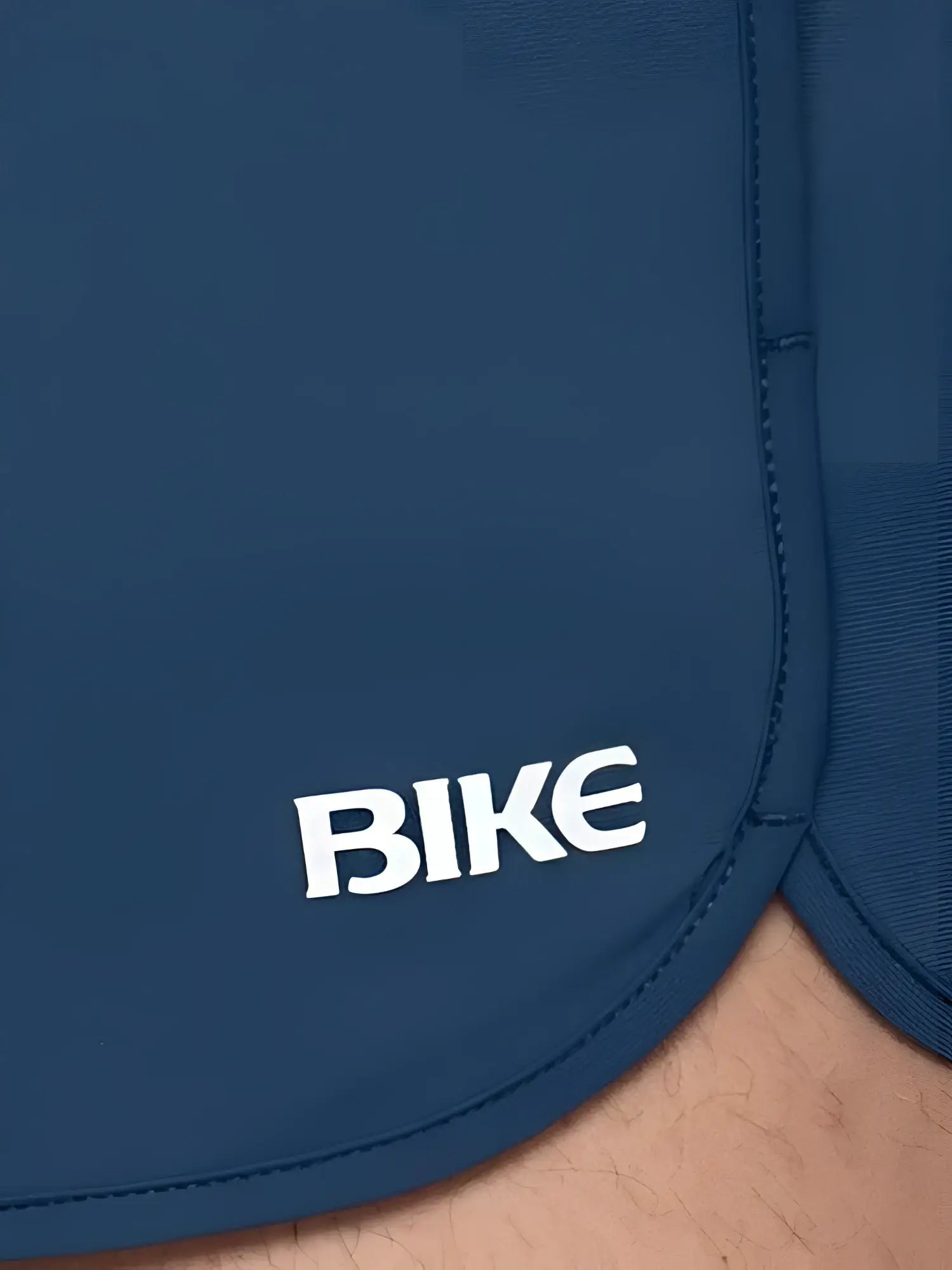 Dark blue bike track short with white bike logo embroidered on the side perfect for athletic use