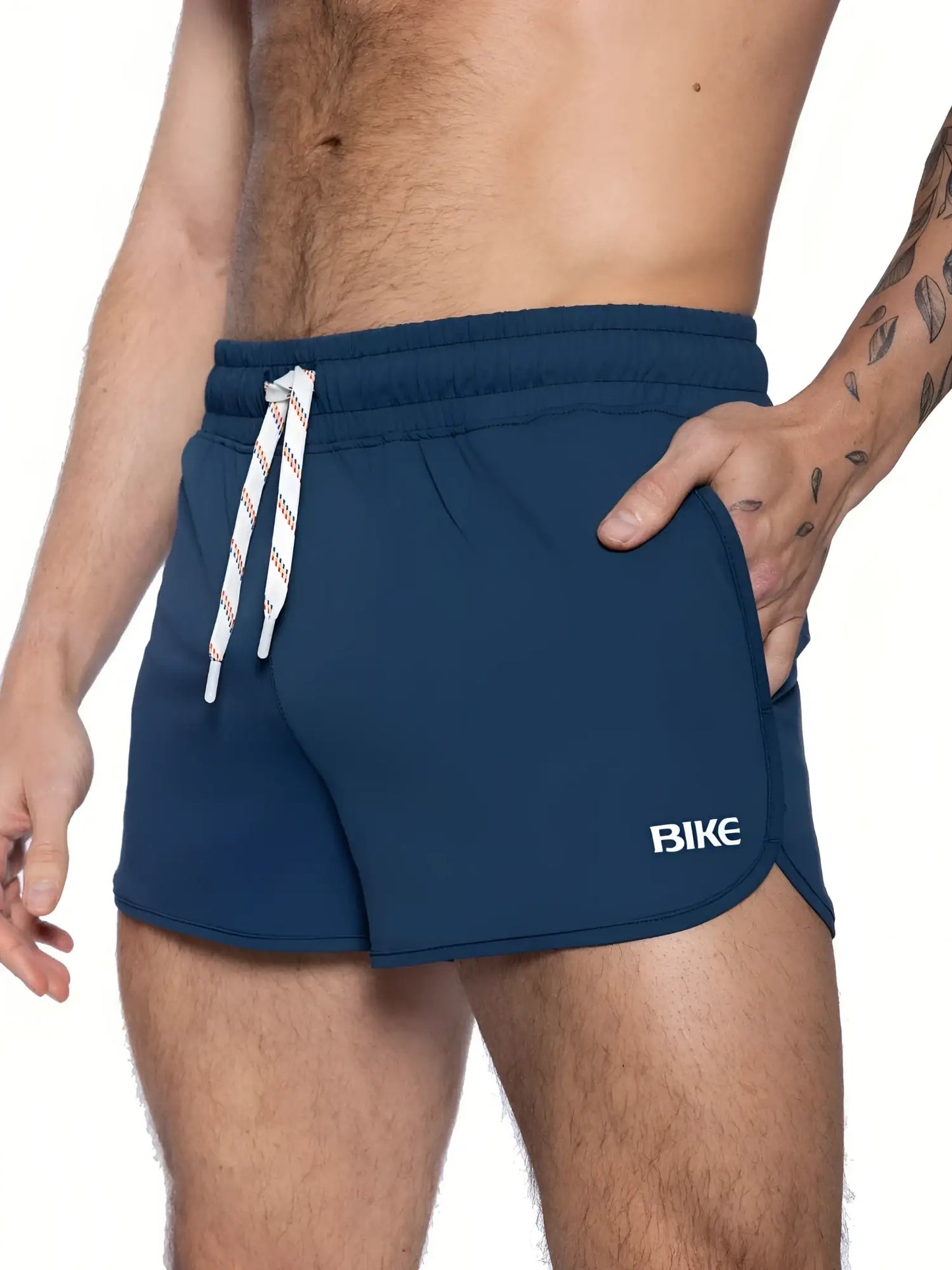 Navy blue BIKE® track short with white drawstring and bike logo on the side designed for athletic use