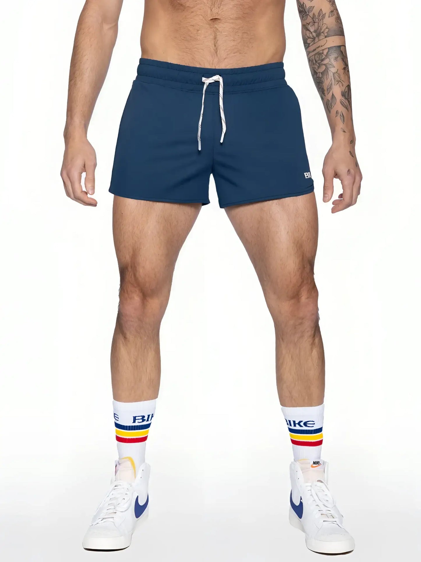 Navy blue bike track shorts with white drawstrings and a small logo on the lower right leg for athletic use