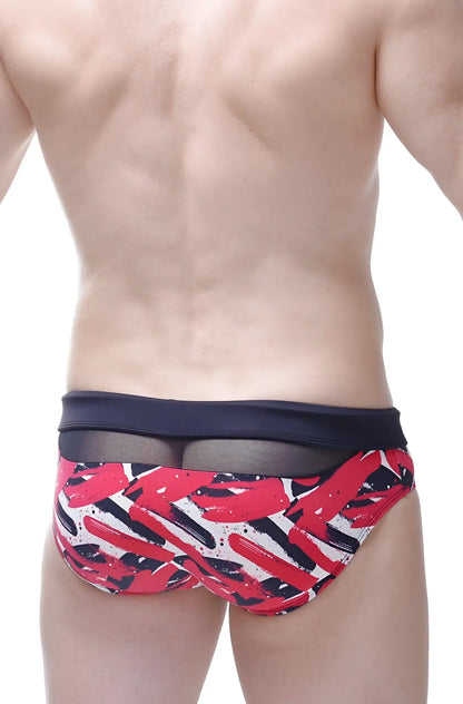 Bikini ajoupa chick swim trunks with red black and white abstract brushstrokes and navy blue mesh waistband