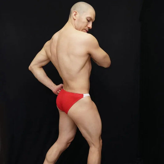 Red mesh bikini underwear by Arroyman featuring a snug fit and contrasting white waistband modeled from the back.