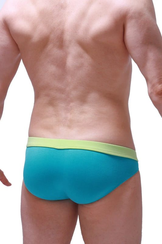 Bikini Manlay tropical green turquoise and lime green swim trunks with snug form-fitting design for beachwear
