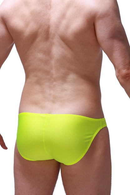 Bright neon yellow bikini Taik Joe swim trunks with smooth form-fitting fabric for comfortable swimwear use