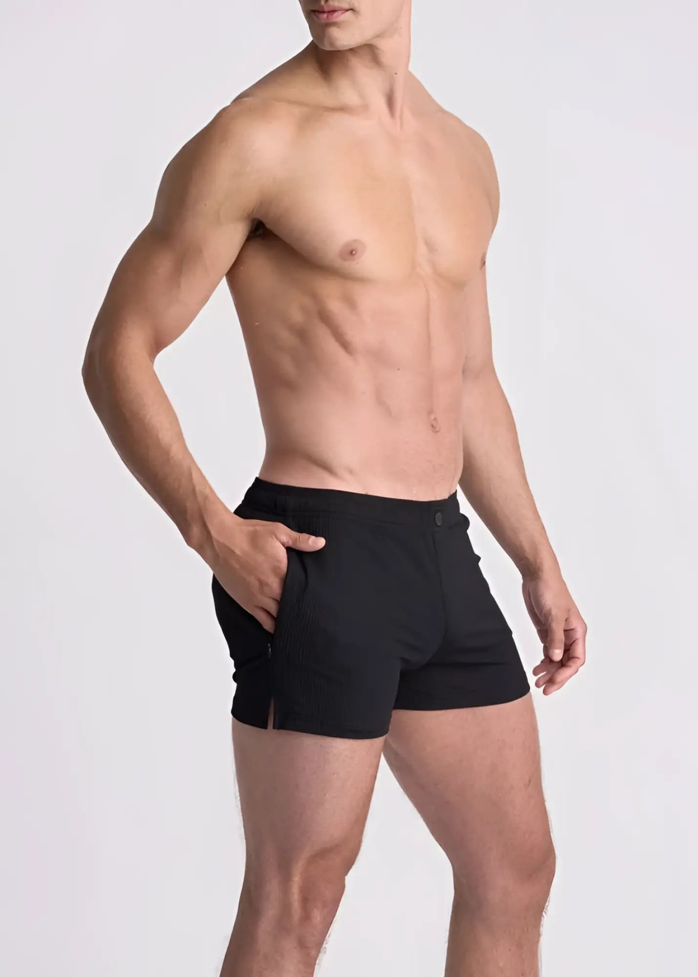 Black seersucker swim shorts with mesh lining featuring a sleek form-fitting design and side pockets