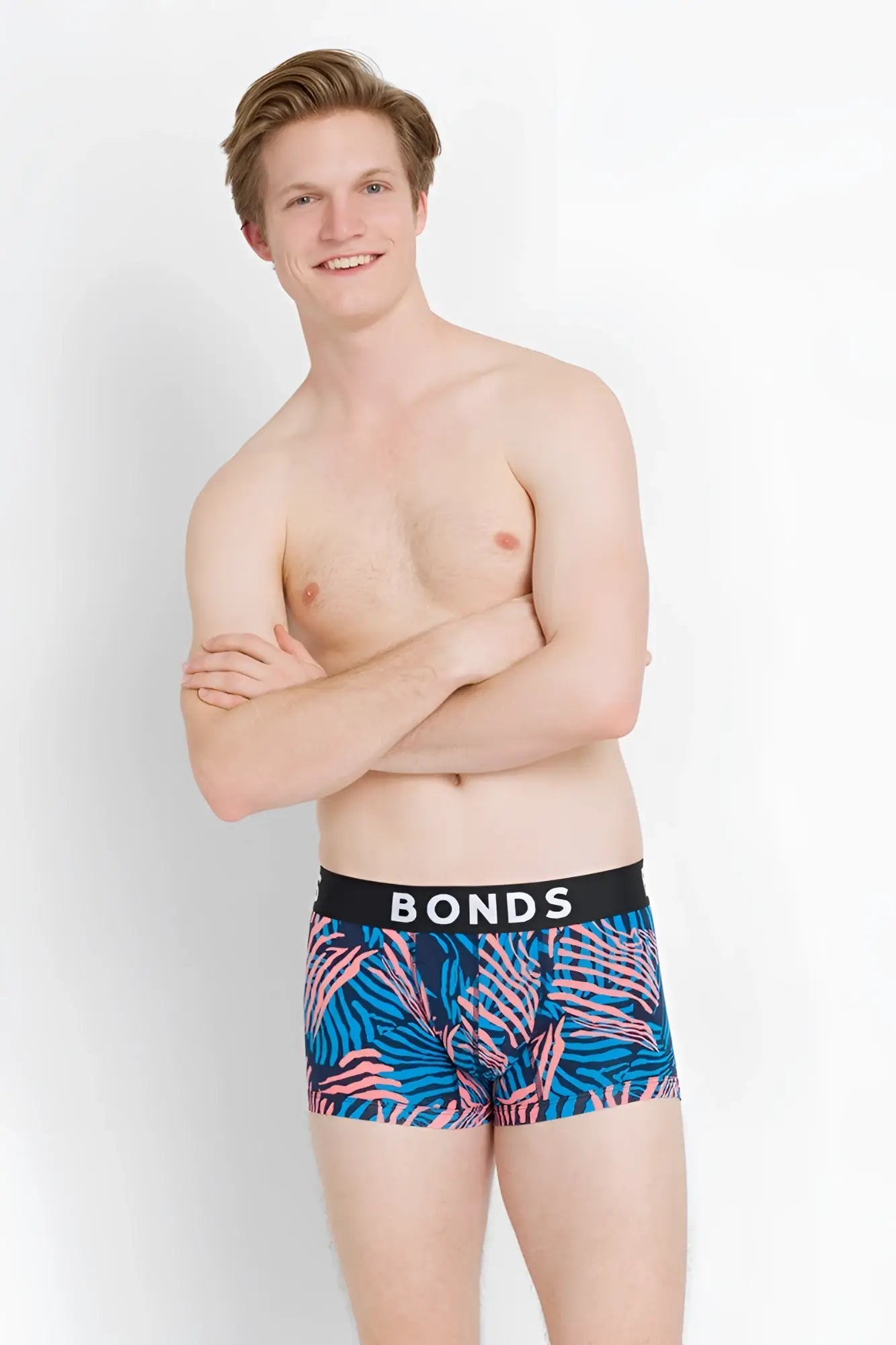 Bonds fit trunk boxer brief underwear in size xs featuring blue and pink tropical leaf pattern with black waistband